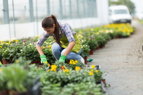 Team member preparing gardening tools at start of shift